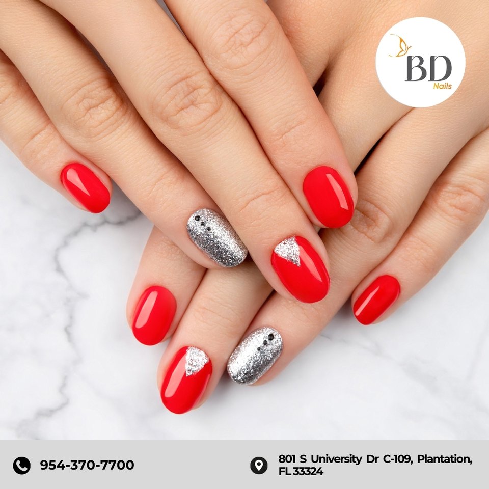Nail technician shaping acrylic extensions